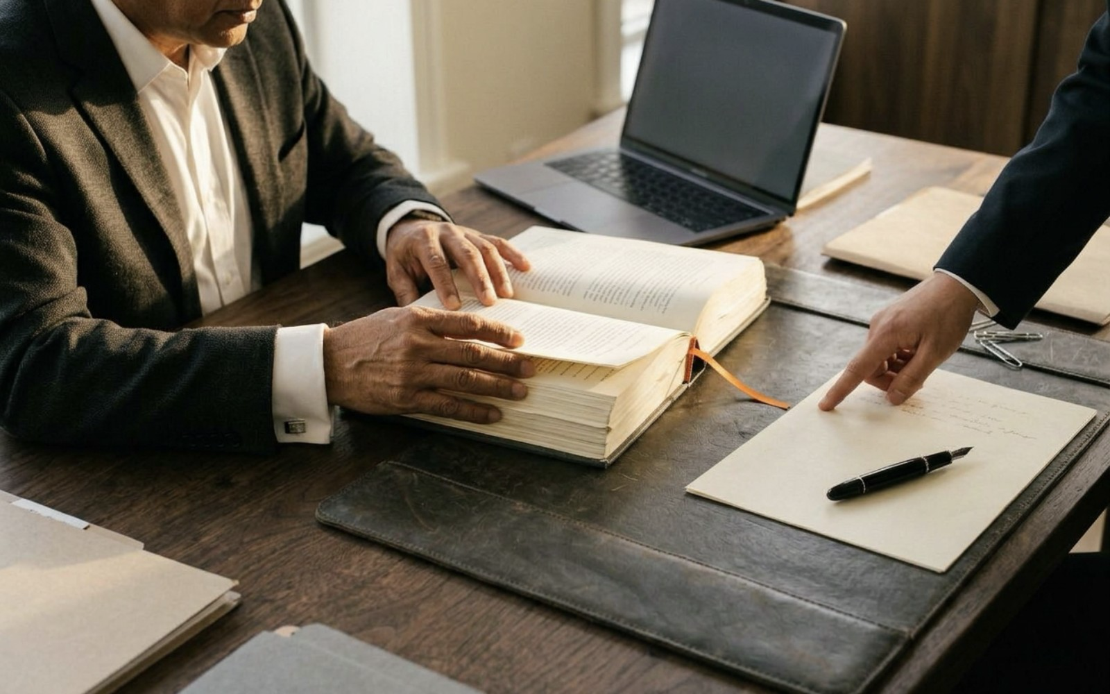 Legal staff working with laptops and case files