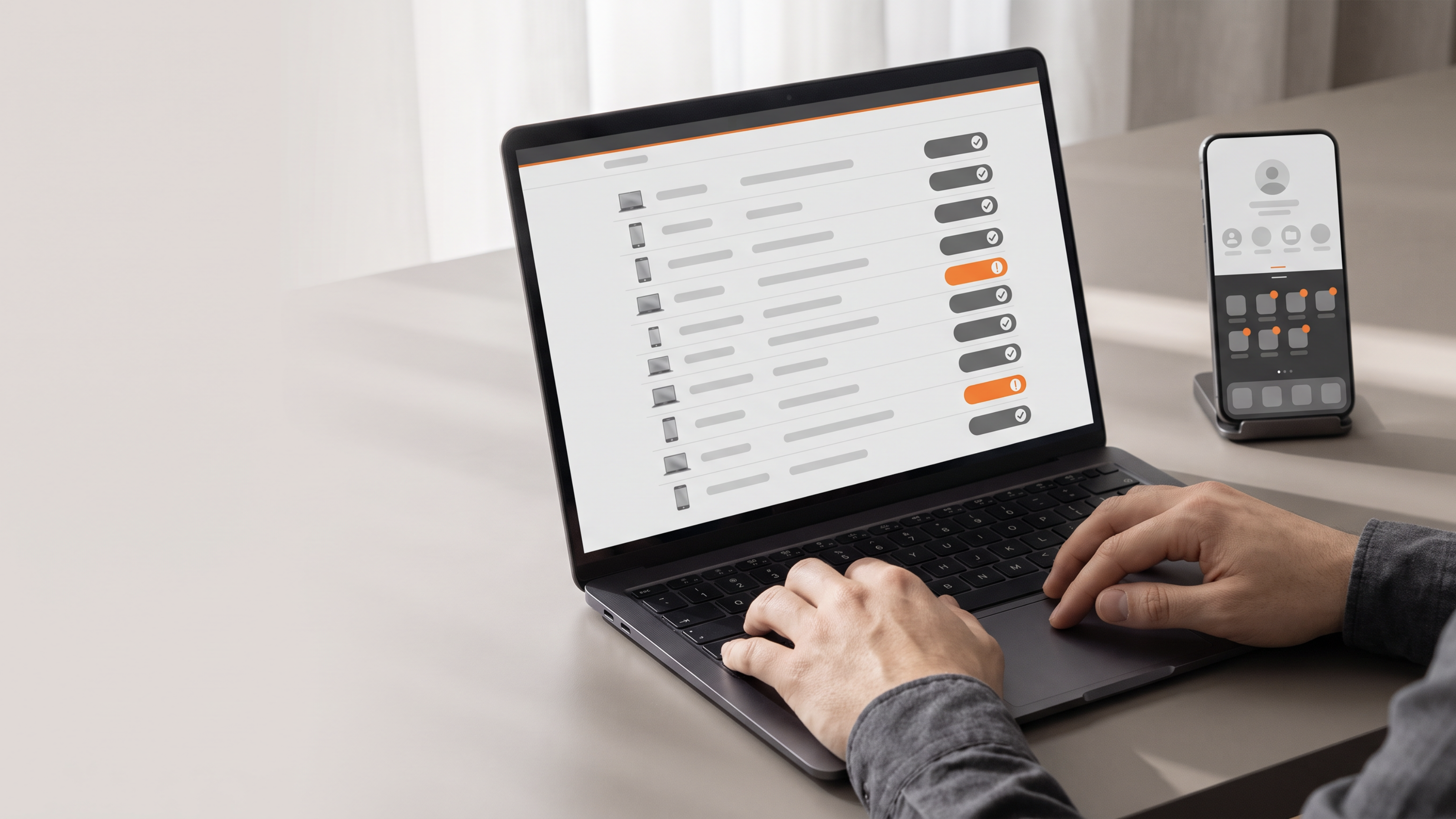 A personal phone beside a work laptop and a compliance checklist